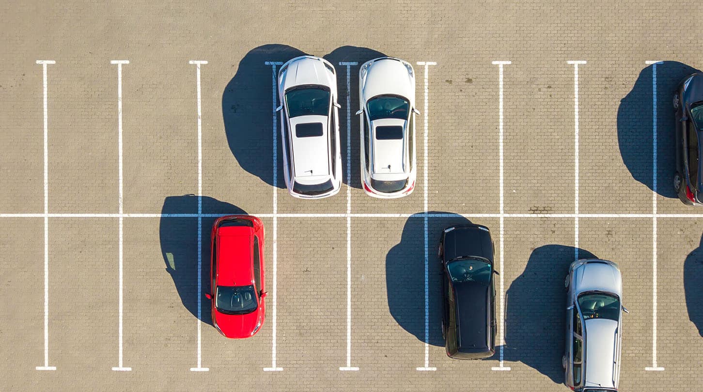 Aerial view of parked cars in a city lot