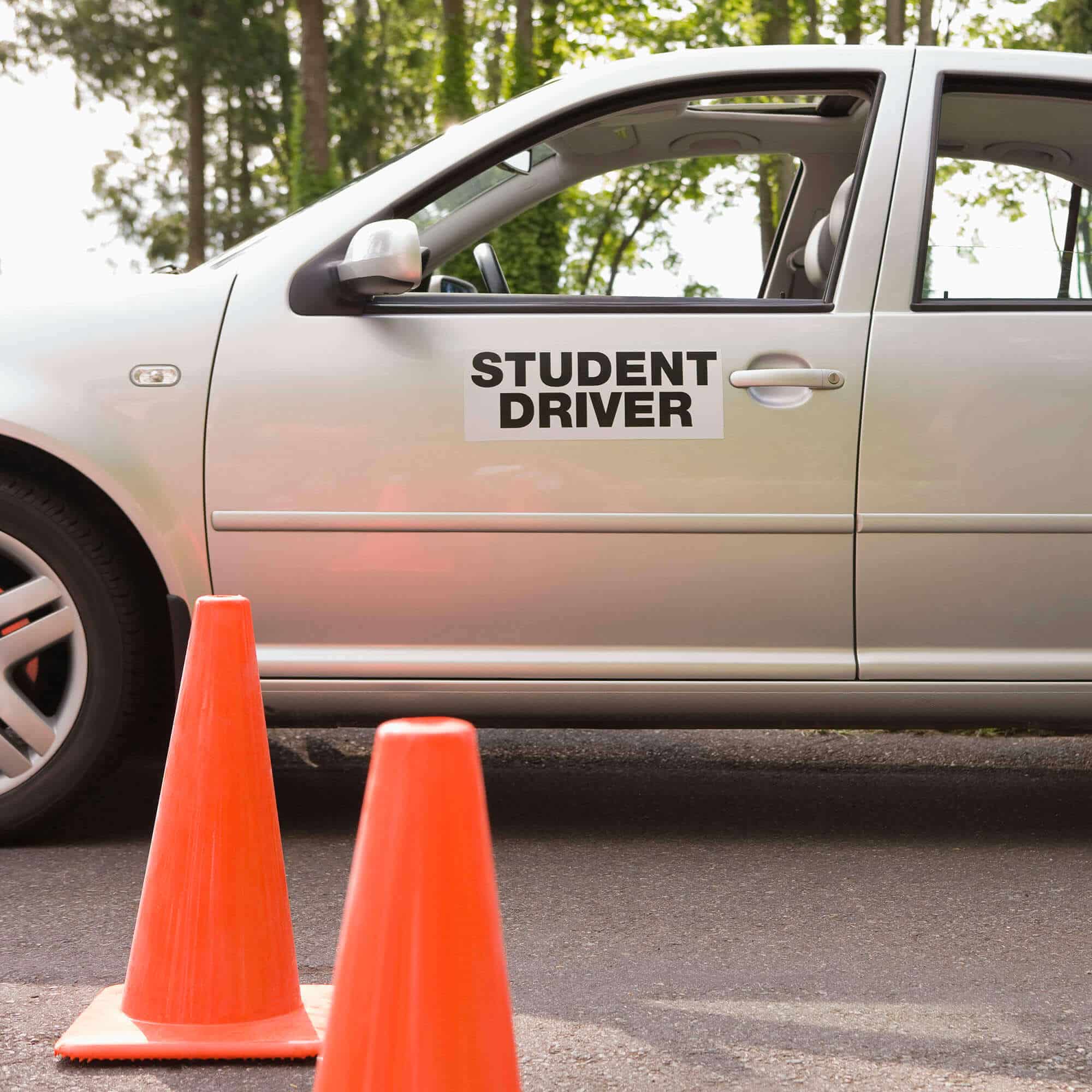 Student driver practicing between traffic cones
